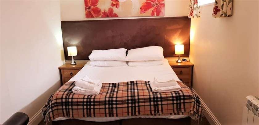 Imagen de la habitación del Hotel The Harbour House. Foto 15