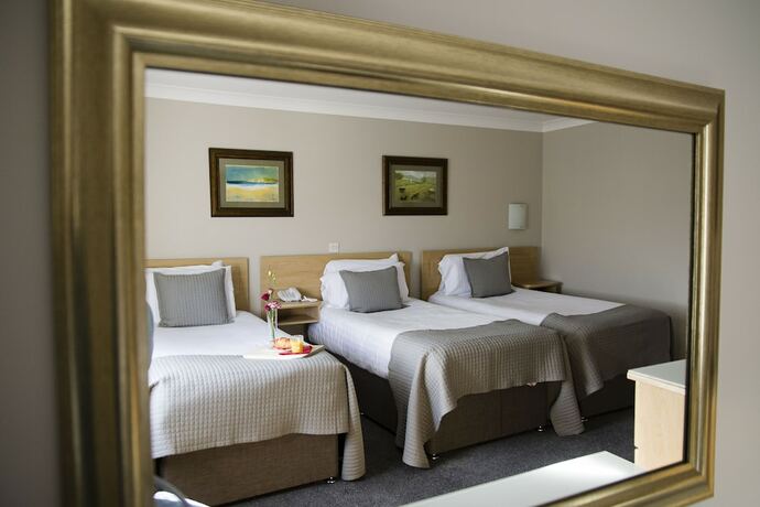 Imagen de la habitación del Hotel The Harbour Inn. Foto 16