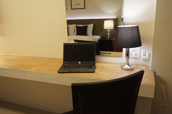 Imagen de la habitación del Hotel The Harmony Ville. Foto 7