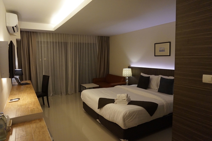Imagen de la habitación del Hotel The Harmony Ville. Foto 13
