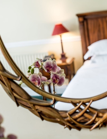 Imagen de la habitación del Hotel The Haycock Manor. Foto 2