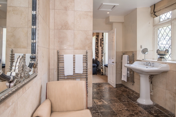 Imagen de la habitación del Hotel The Haycock Manor. Foto 7