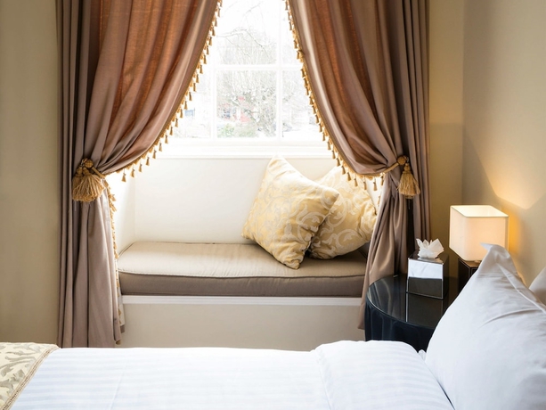 Imagen de la habitación del Hotel The Haycock Manor. Foto 9