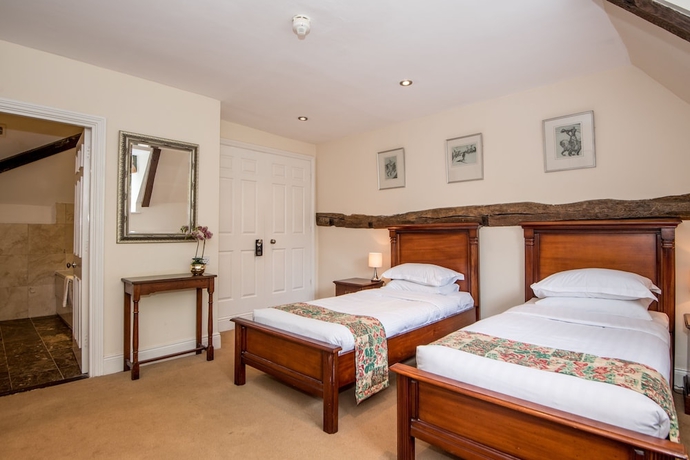 Imagen de la habitación del Hotel The Haycock Manor. Foto 11