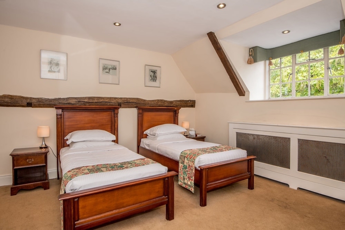 Imagen de la habitación del Hotel The Haycock Manor. Foto 12