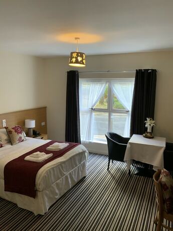 Imagen de la habitación del Hotel The Hedges. Foto 16