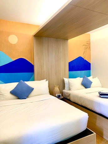 Imagen de la habitación del Hotel The Henry Resort Taramindu Laiya. Foto 7