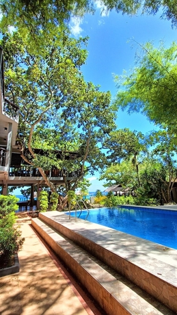 Imagen de la piscina del Hotel The Henry Resort Taramindu Laiya. Foto 15