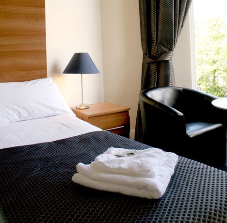 Imagen de la habitación del Hotel The Heritage. Foto 6