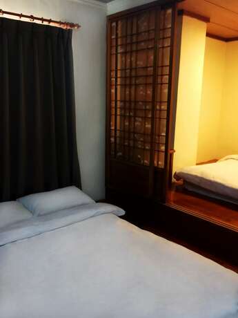 Imagen de la habitación del Hotel The Hermit Inn. Foto 16