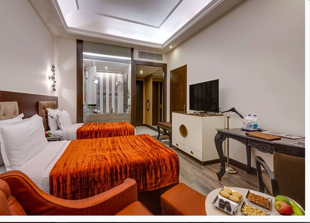 Imagen de la habitación del Hotel The Hhi Kolkata. Foto 9