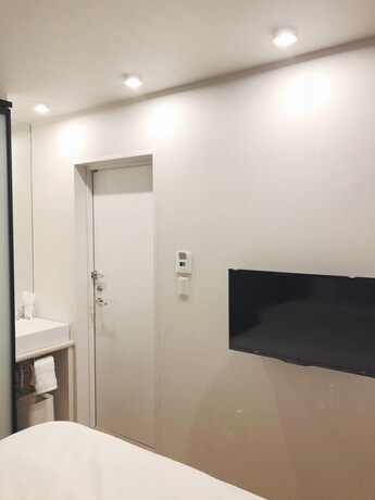 Imagen de la habitación del Hotel The Hideout Tokyo. Foto 20