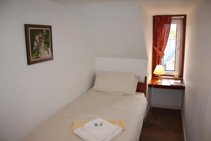 Imagen de la habitación del Hotel The Highland Guest House. Foto 6