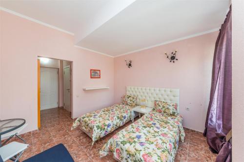 Imagen de la habitación del Hotel The Hloya Inn. Foto 8