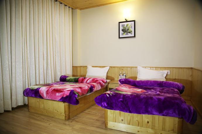 Imagen de la habitación del Hotel The Holiday Heights Manali. Foto 10