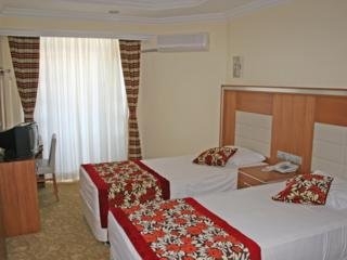 Imagen de la habitación del Hotel The Holiday Resort. Foto 8