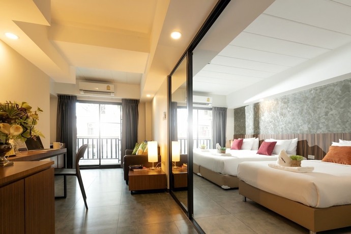Imagen de la habitación del Hotel The Home, Bangkok. Foto 2
