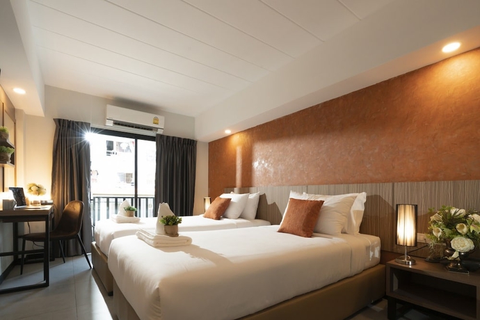 Imagen de la habitación del Hotel The Home, Bangkok. Foto 4