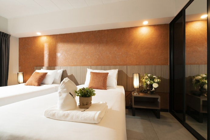 Imagen de la habitación del Hotel The Home, Bangkok. Foto 5