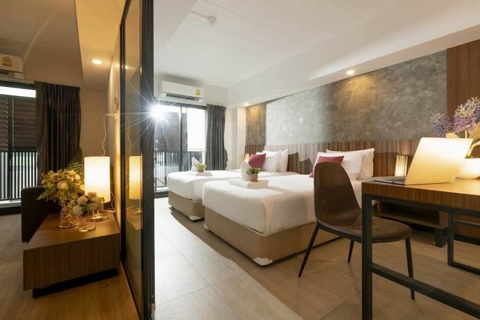 Imagen de la habitación del Hotel The Home, Bangkok. Foto 6