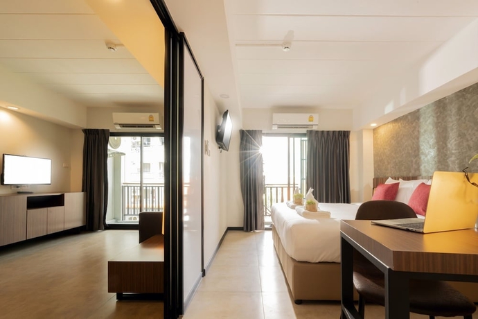 Imagen de la habitación del Hotel The Home, Bangkok. Foto 9