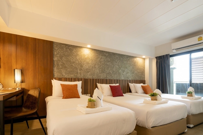 Imagen de la habitación del Hotel The Home, Bangkok. Foto 10
