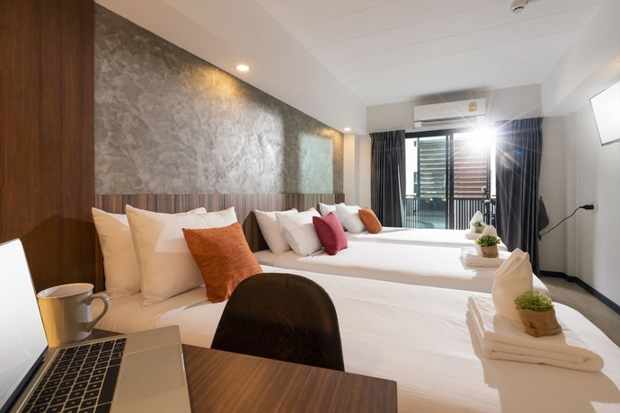 Imagen de la habitación del Hotel The Home, Bangkok. Foto 11