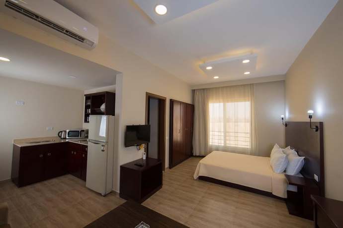 Imagen de la habitación del Hotel The Home, Sheikh Zayed City. Foto 7