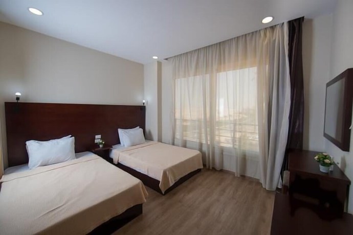 Imagen de la habitación del Hotel The Home, Sheikh Zayed City. Foto 10