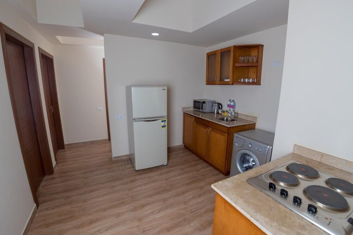 Imagen de la habitación del Hotel The Home, Sheikh Zayed City. Foto 11