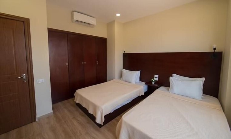 Imagen de la habitación del Hotel The Home, Sheikh Zayed City. Foto 13