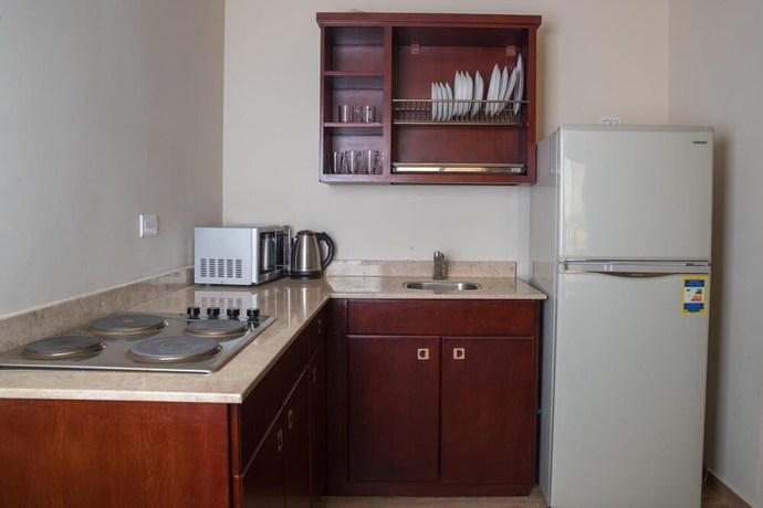 Imagen de la habitación del Hotel The Home, Sheikh Zayed City. Foto 17