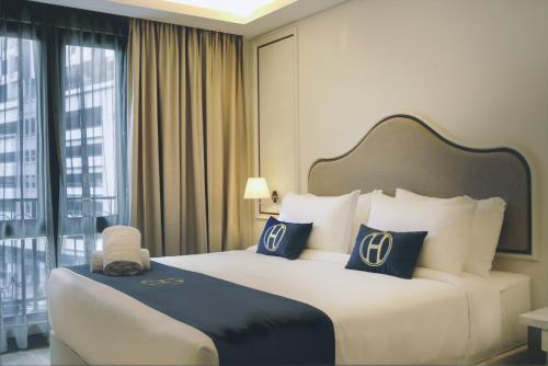Imagen de la habitación del Hotel The Host. Foto 16