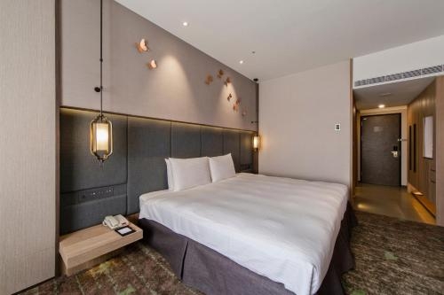 Imagen de la habitación del Hotel The Howard Prince Taichung. Foto 8