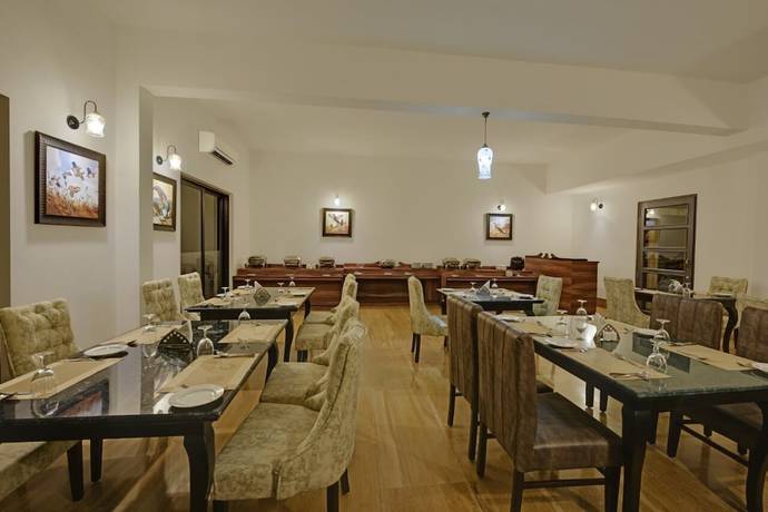 Imagen del bar/restaurante del Hotel The Hunting Lodge. Foto 7