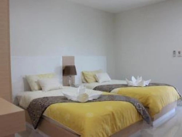 Imagen de la habitación del Hotel The Infinity Suite Chiang Rai. Foto 9