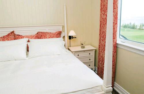 Imagen de la habitación del Hotel The Inn At Cobble Beach. Foto 3