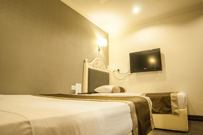 Imagen de la habitación del Hotel The Inn At Temple Street. Foto 2