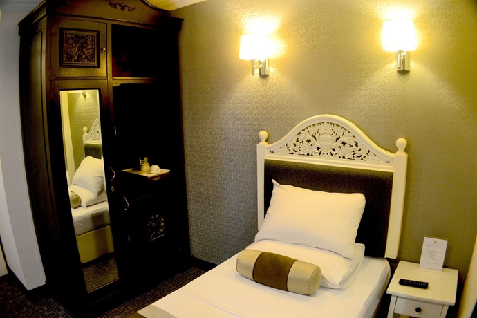 Imagen de la habitación del Hotel The Inn At Temple Street. Foto 3