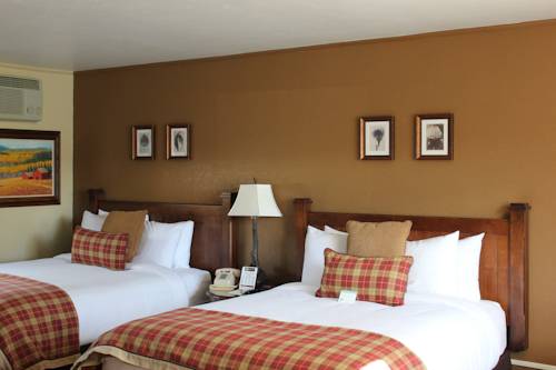 Imagen de la habitación del Hotel The Inn At Tomichi Village. Foto 3