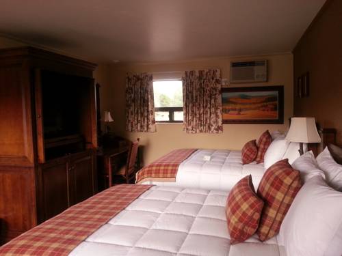 Imagen de la habitación del Hotel The Inn At Tomichi Village. Foto 8