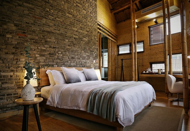 Imagen de la habitación del Hotel The International Cultural and Creative Bamboo Village. Foto 8