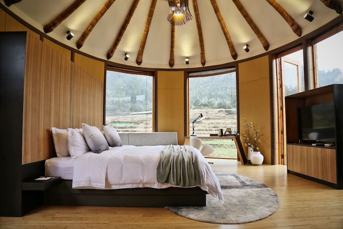 Imagen de la habitación del Hotel The International Cultural and Creative Bamboo Village. Foto 9