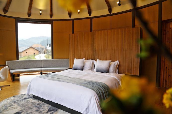 Imagen de la habitación del Hotel The International Cultural and Creative Bamboo Village. Foto 10