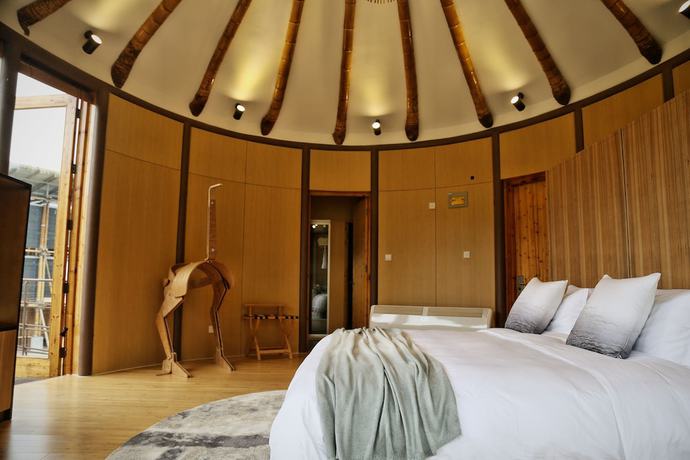 Imagen de la habitación del Hotel The International Cultural and Creative Bamboo Village. Foto 11