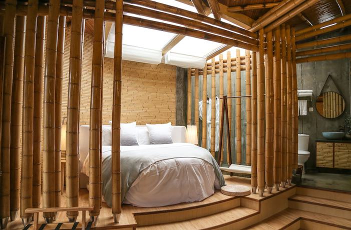 Imagen de la habitación del Hotel The International Cultural and Creative Bamboo Village. Foto 12