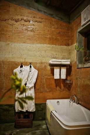 Imagen de la habitación del Hotel The International Cultural and Creative Bamboo Village. Foto 14