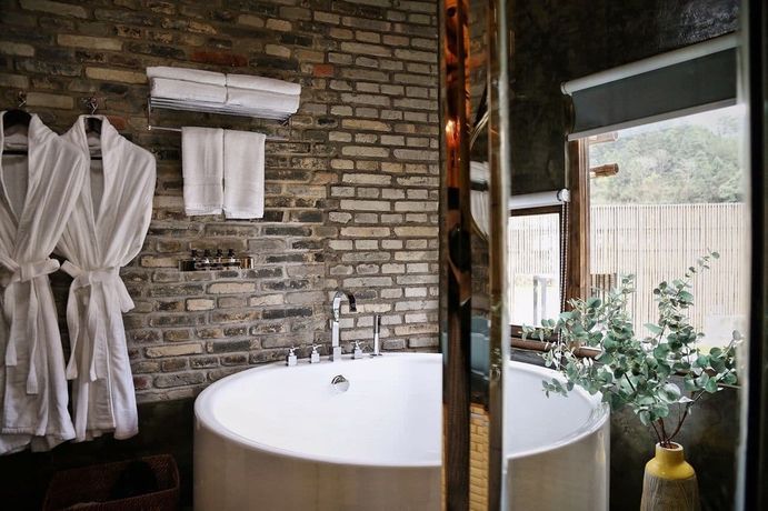 Imagen de la habitación del Hotel The International Cultural and Creative Bamboo Village. Foto 15