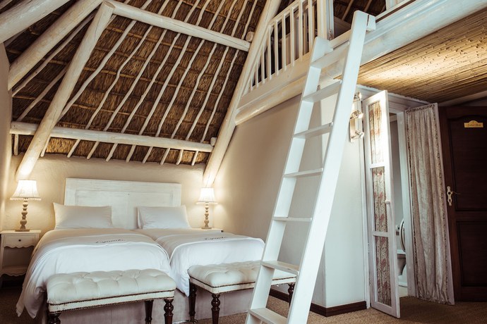 Imagen de la habitación del Hotel The Iris Boutique. Foto 10