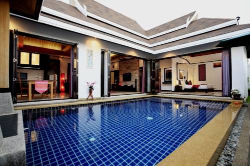 Imagen de la habitación del Hotel The Iris Pool Villa. Foto 4